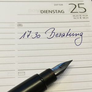 Terminkalender mit eingetragenem Termin